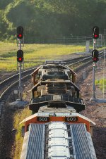 BNSF 503 and 3198 are eastbound passing the Amtrak Station and the old Burlington Depot 